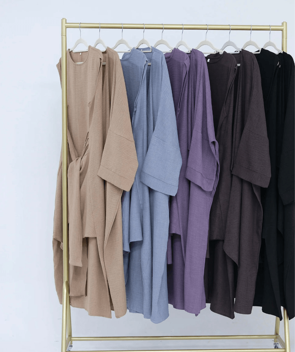 Set of attached wrap abayas in various colors, showcasing elegant modest fashion